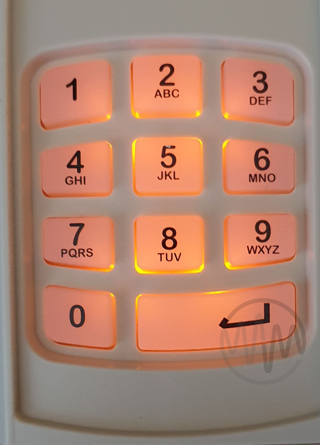 Close up of Guardian WKCC keypad buttons with orange back light 